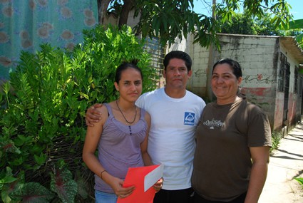 man standing with two women