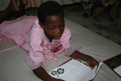 A child reading a letter