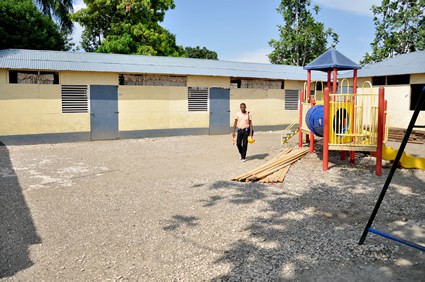 man in front of school building