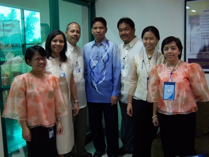 group of men and women smiling