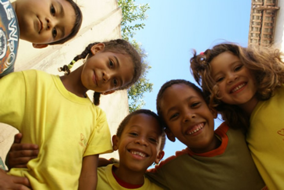 group of children looking down at camera