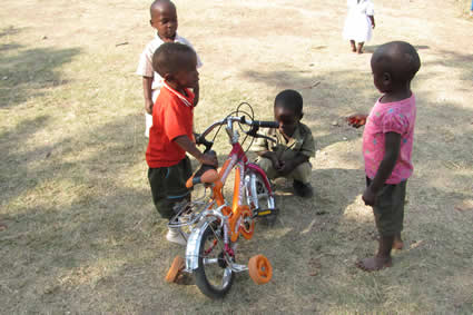 children playing with a bicycle