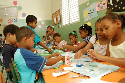 children doing crafts in classroom