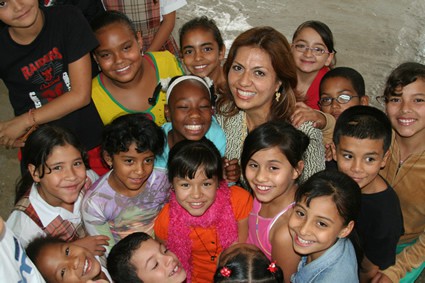 woman surrounded by children