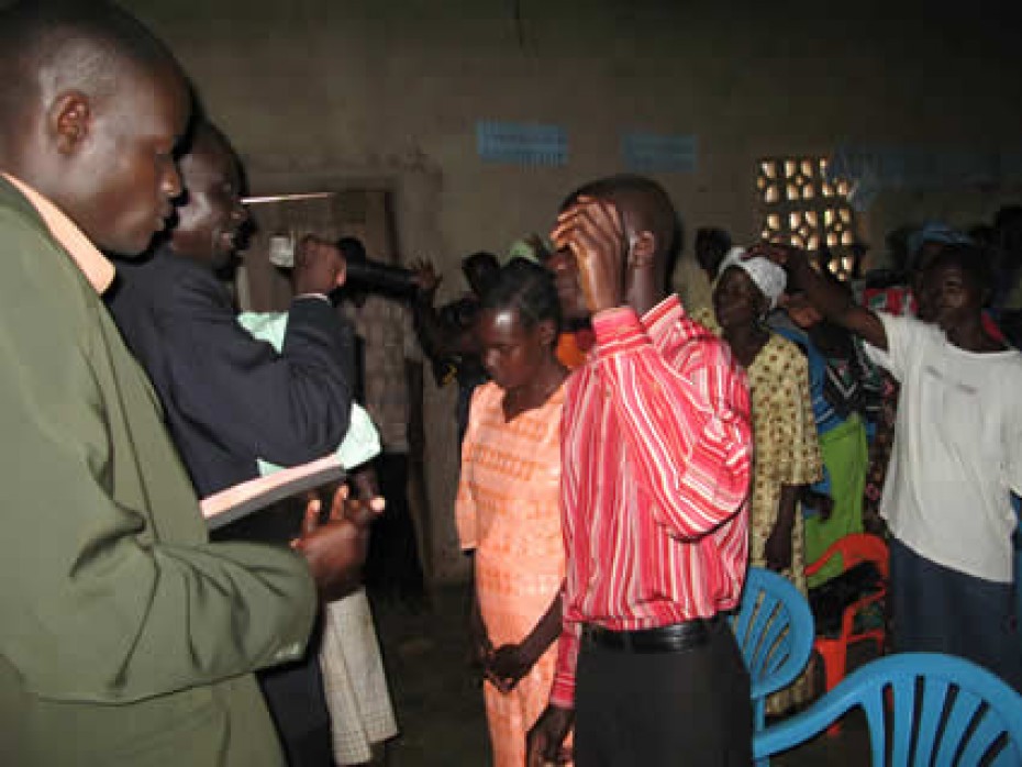 preaching-in-UG man preaching during church service