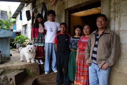 family standing outside home in Guatemala