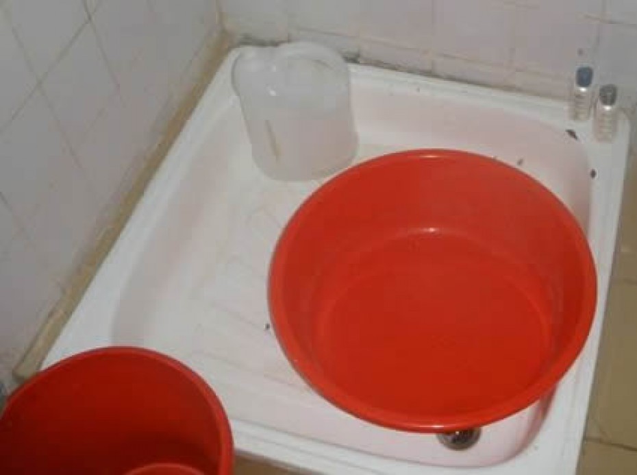 red bucket in sink