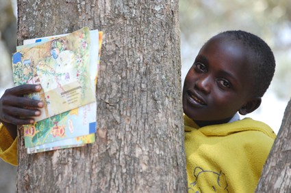 young girl holding letters