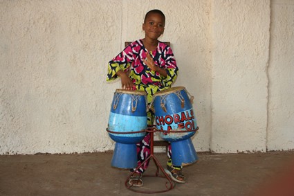 girl playing traditional drums