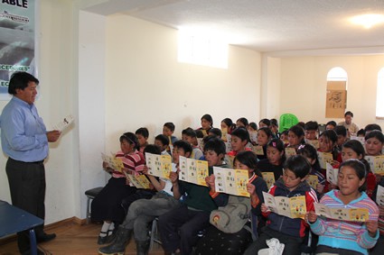 man teaching a classroom of children