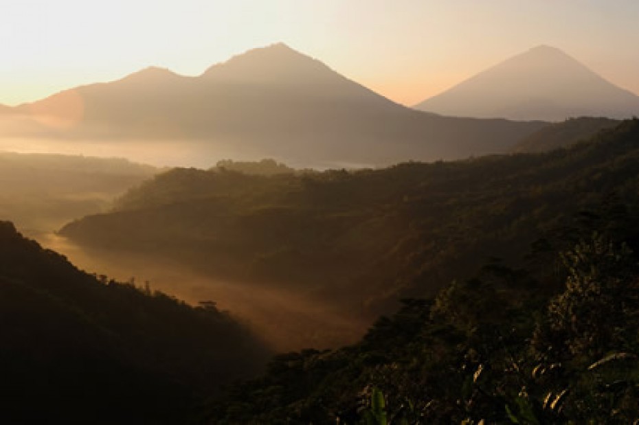 Mountain sunrise with fog.