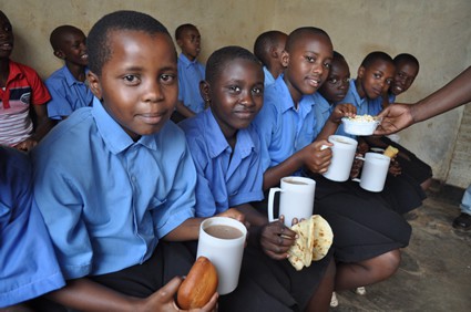 children holding cups and snacks