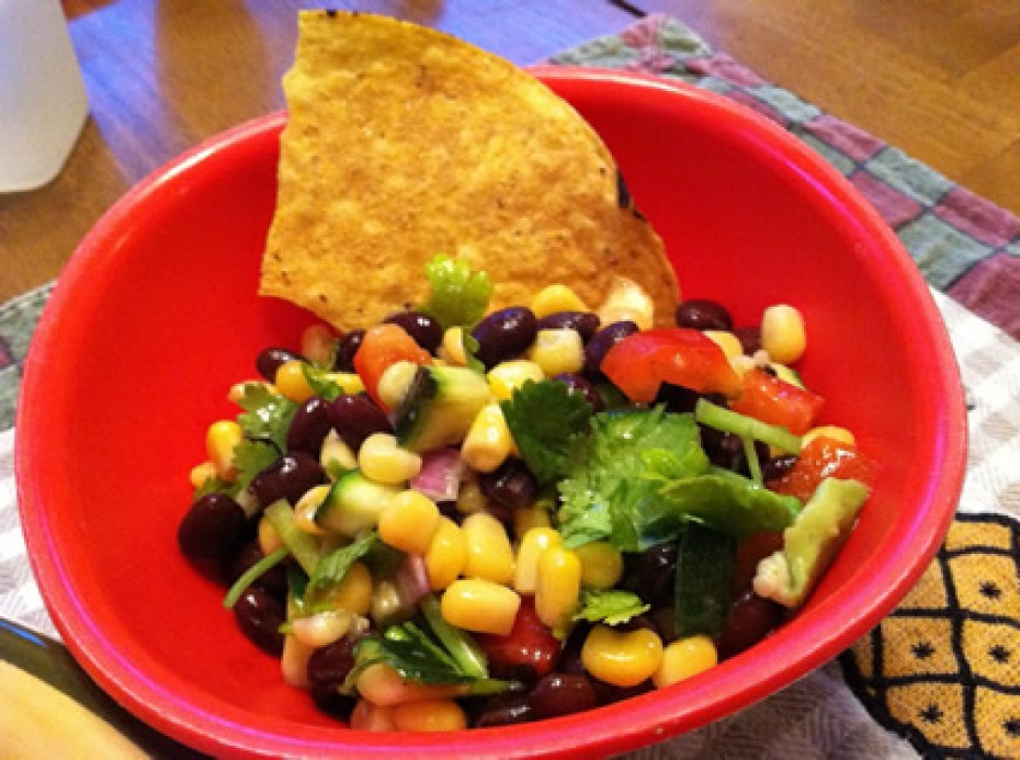 black bean salad in red bowl