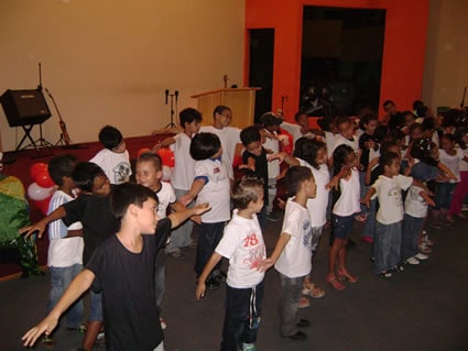 group of children with outstretched arms