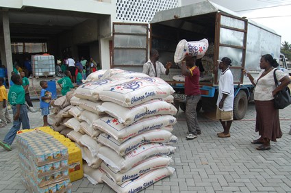 men unloading food from truck