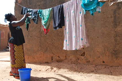 woman hanging laundry on a clothesline