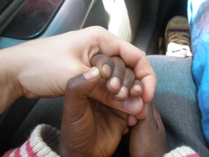 two people holding hands