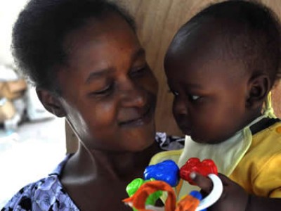 close up of woman holding baby