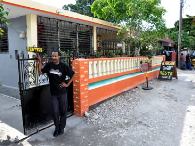 man standing outside restaurant in Haiti