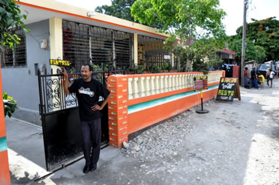 man standing outside restaurant in Haiti