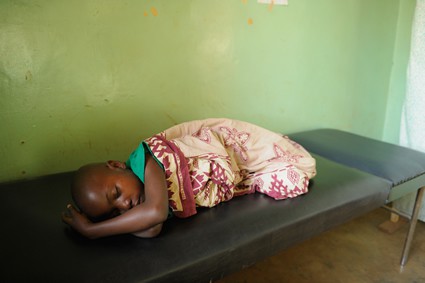 baby sleeping on a cot