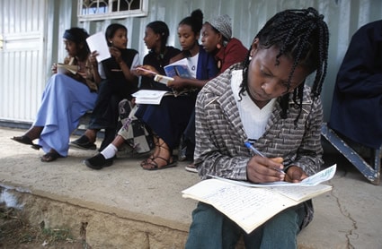 young people writing letters