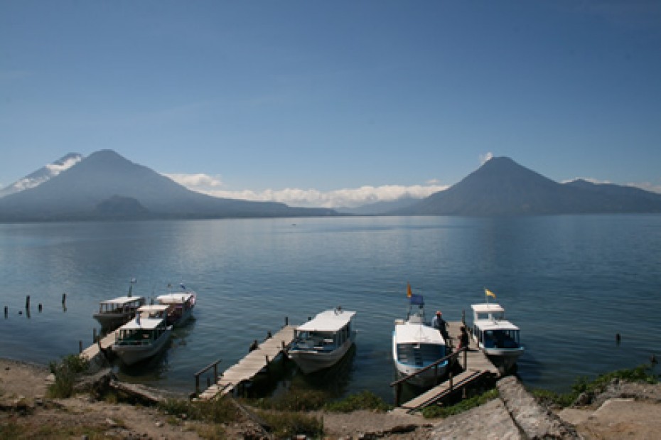 lake with several docked boats