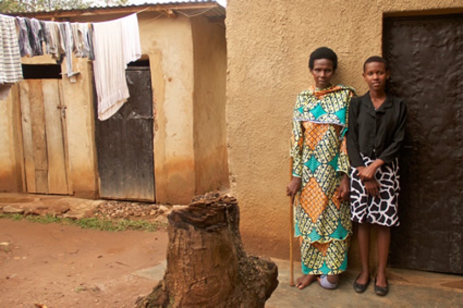 woman and girl standing outside home in Rwanda