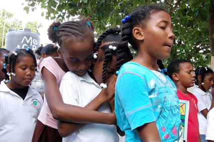 group of children praying