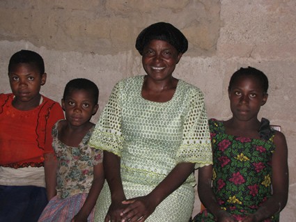 woman sitting with three girls