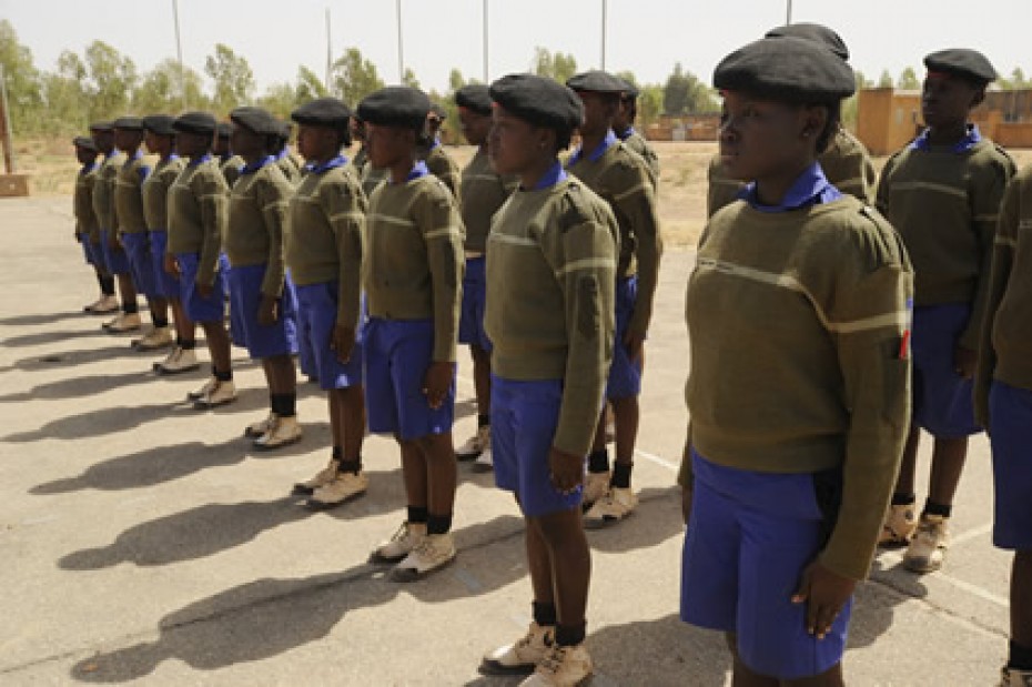 teens standing at attention in uniforms