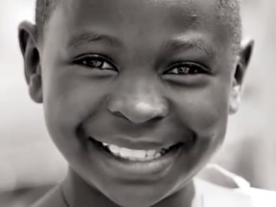 Young child smiling.