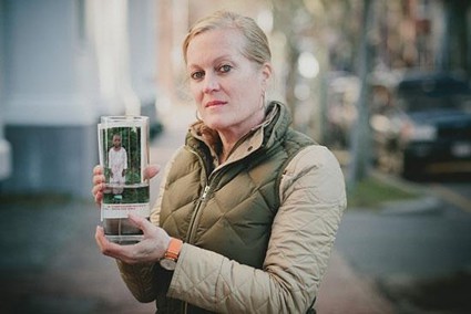 woman holding a picture of a child