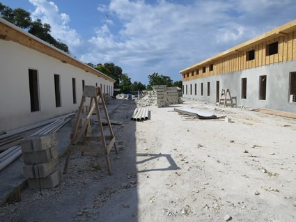 Two buildings being constructed.