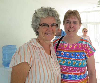 Two ladies smiling.