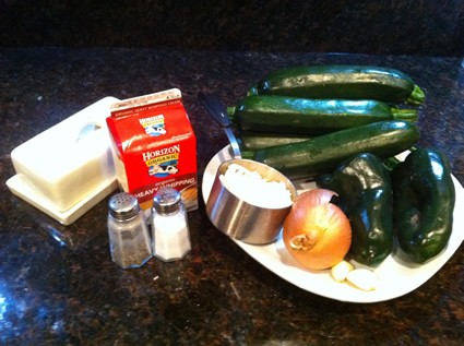 ingredients for a recipe with zuchinni, milk, butter, onions, salt and pepper