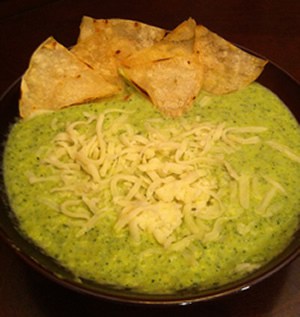 soup sprinkled with cheese and tortilla chips