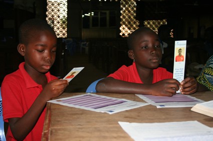 boys holding bookmarks