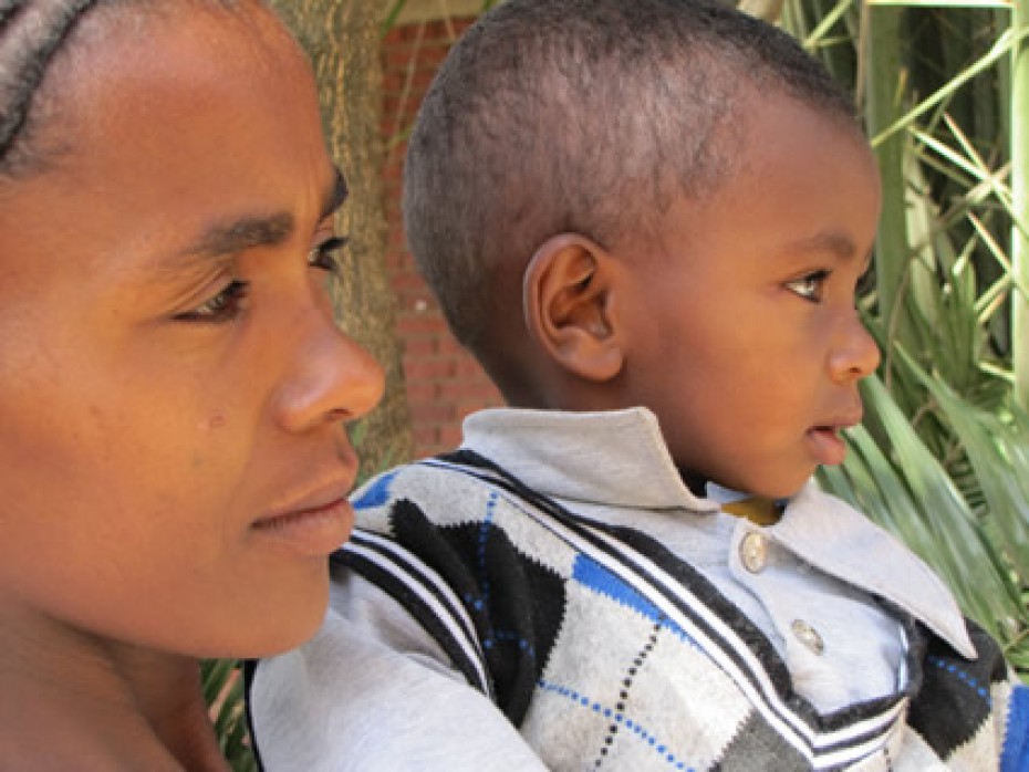 a woman holding a baby