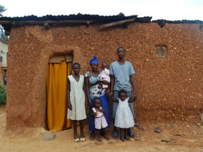 family standing outside home