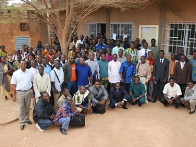 large groups of adults outside a building