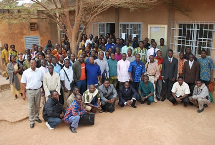 large gathering of people posing for photo