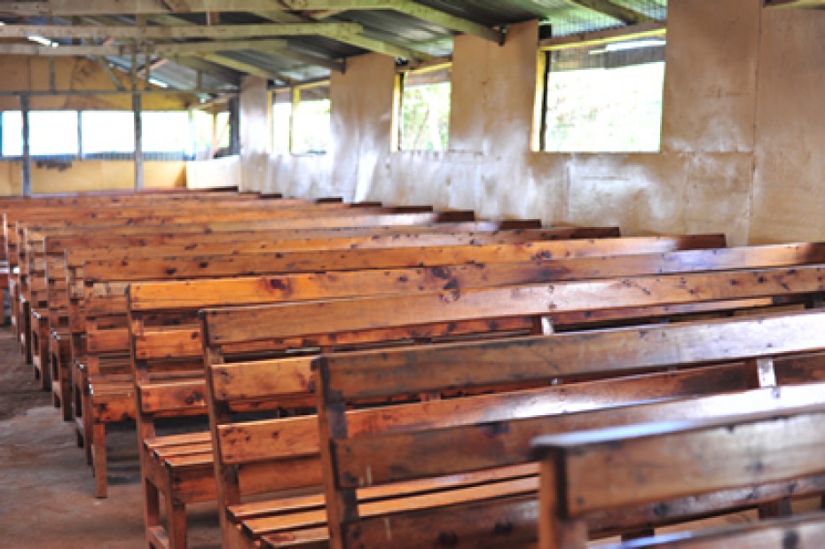 wooden benches inside Kenyan church