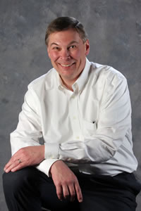 smiling man in white shirt