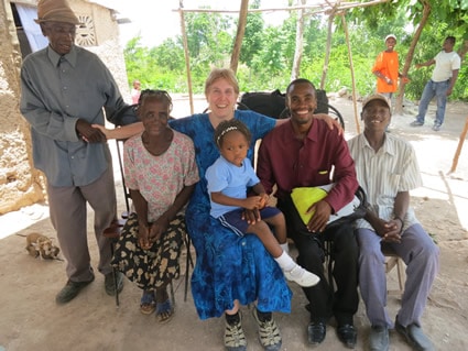 woman sitting with a family with small child on her lap