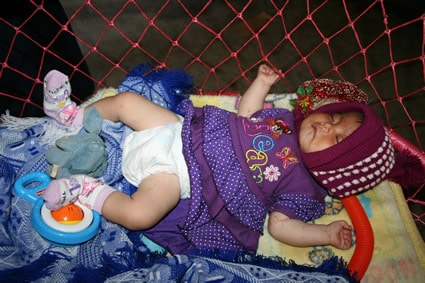 baby sleeping on a blanket