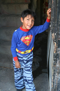 young boy wearing superman shirt