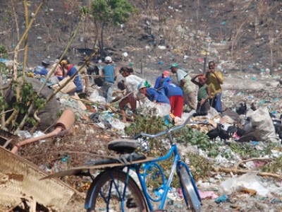 people at garbage dump