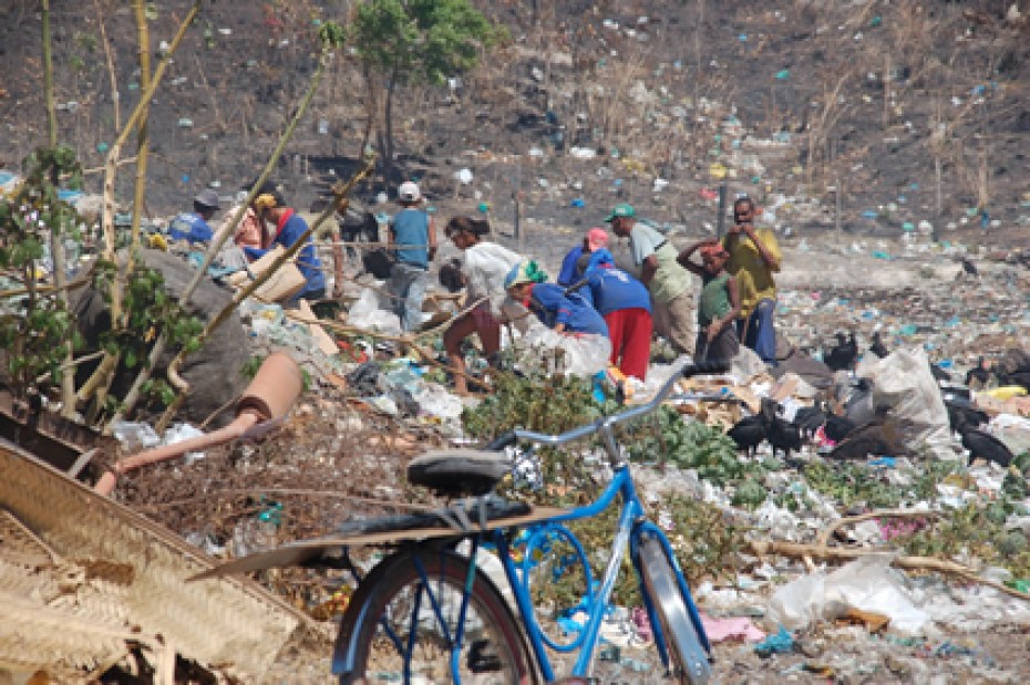 people at garbage dump