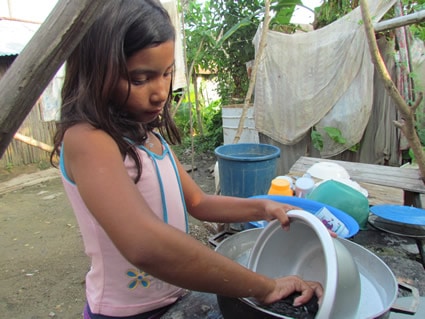 girl washing dishes